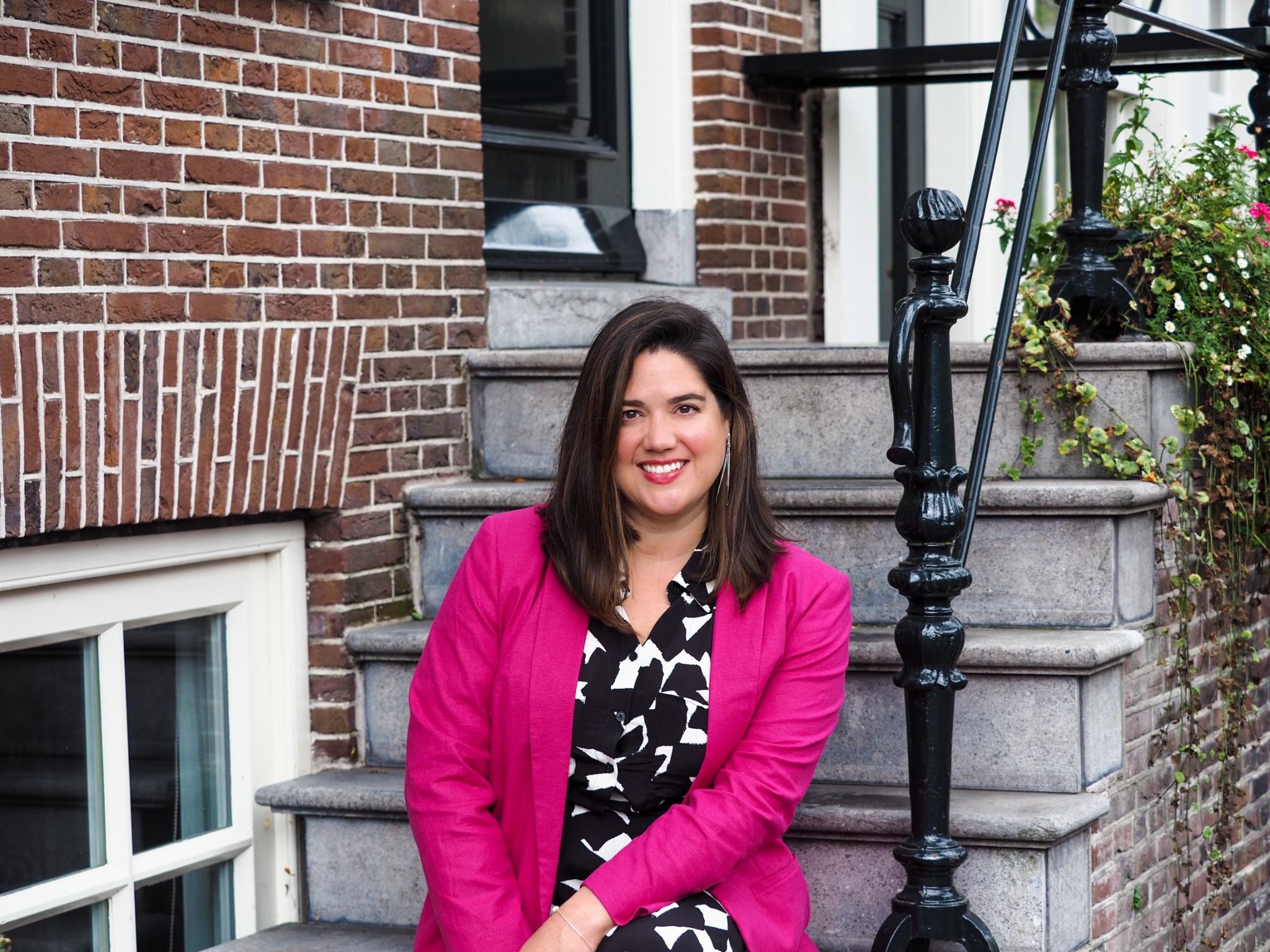 Laurie seated outside an Amsterdam townhouse